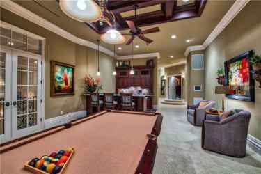Game Room with Balcony Access to view the Front of Estate