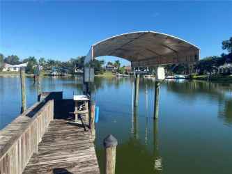 Boat dock with Boat Lift and Cover.. boat to Mantee River and Gulf of Mexico from your back yard