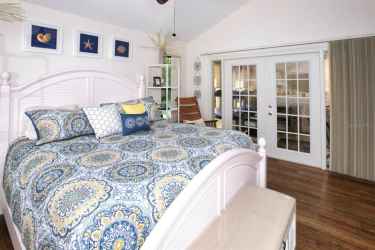 Master bedroom with french doors to lanai.
