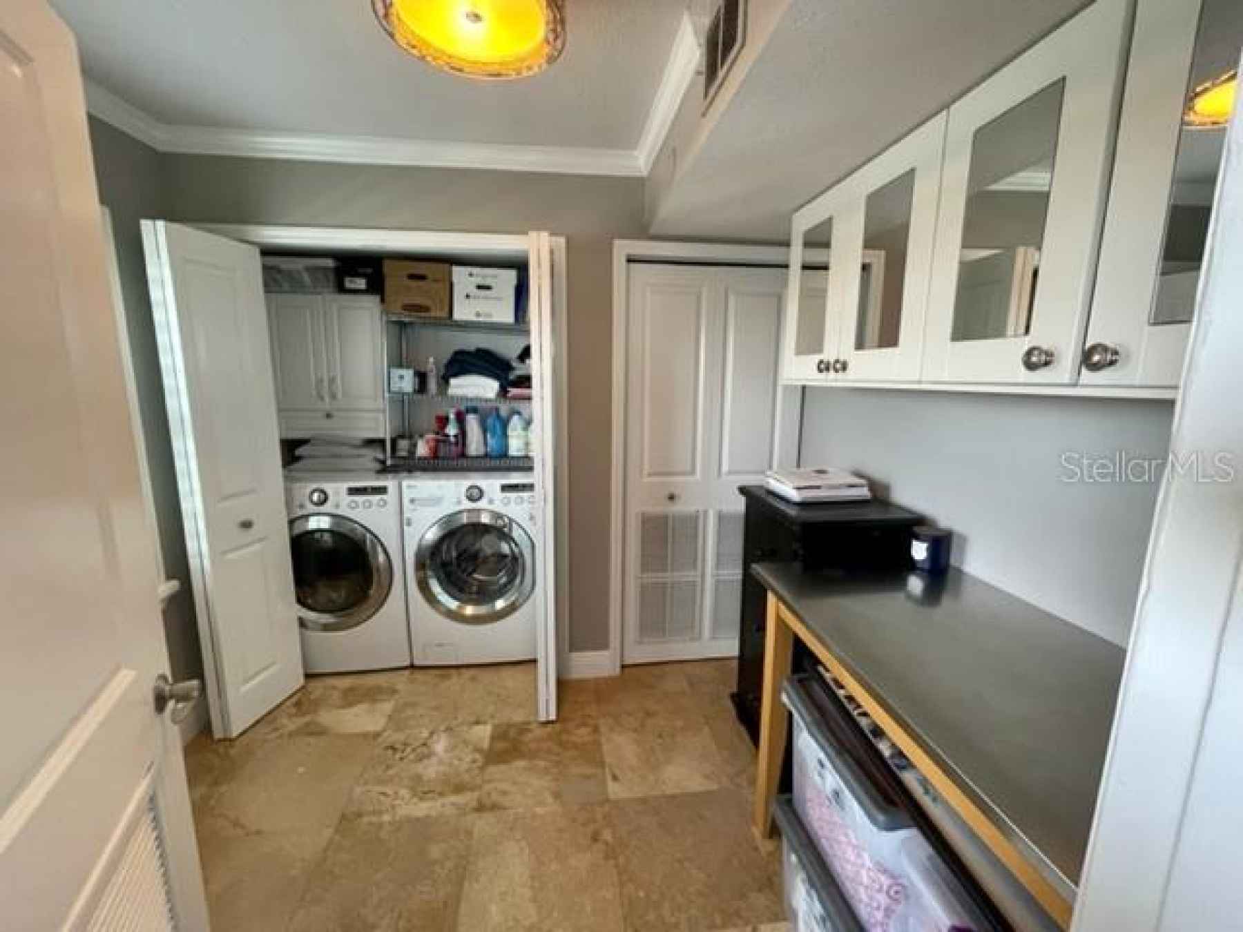 INDOOR LAUNDRY ROOM LARGE ENOUGH TO ALSO USE AS SMALL OFFICE