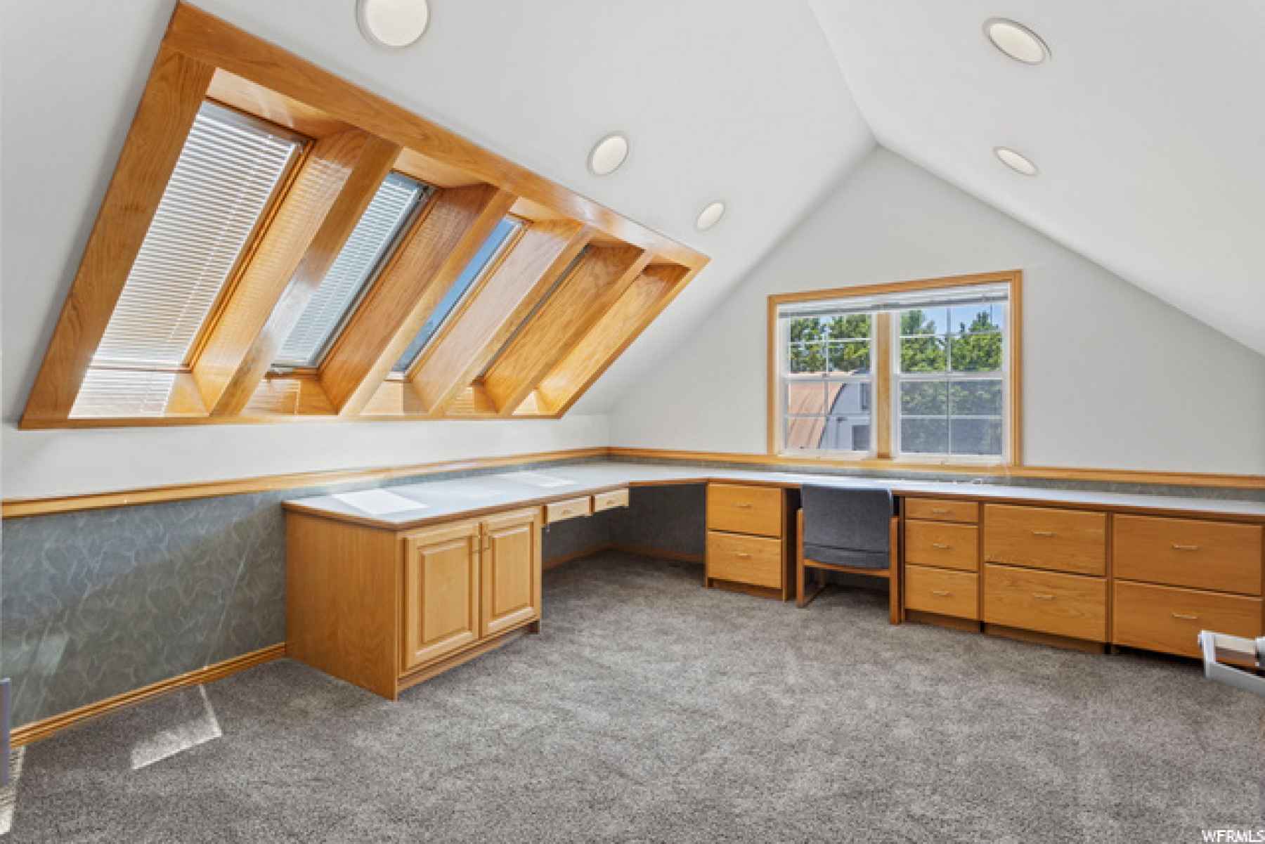 This bedroom has plenty of built in drawers and desk area as well as room for a bed!