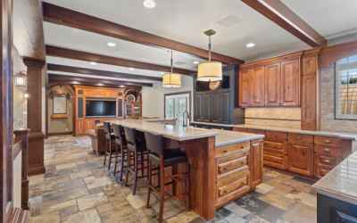 You will love this gourmet kitchen with two work spaces and large snack bar! Built in warming oven, wolf double oven, sub zero fridge!