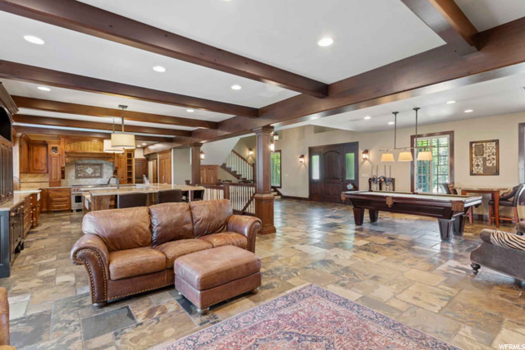 Fantastic open concept living! This large family room has entrance to back yard, plantation shutters (throughout of course!), surround sound (equipment and tv stay)!