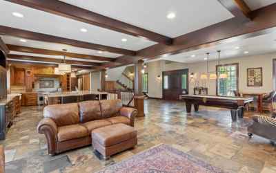 Fantastic open concept living! This large family room has entrance to back yard, plantation shutters (throughout of course!), surround sound (equipment and tv stay)!