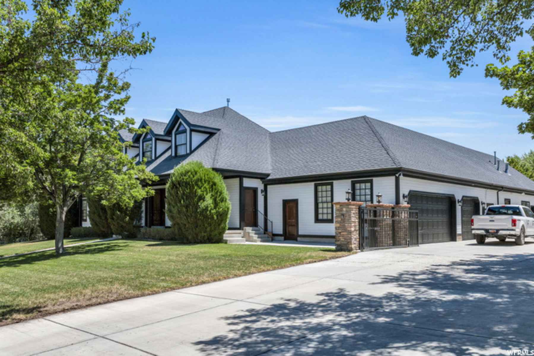 Gated drive with all the parking you will ever need! Huge oversized garage, plus 100X60 quonset!