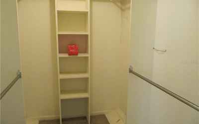 Master walk in closet with built in shelves