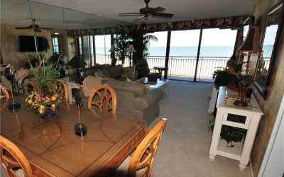 Your spacious living room / dining room overlooking the Gulf of Mexico.