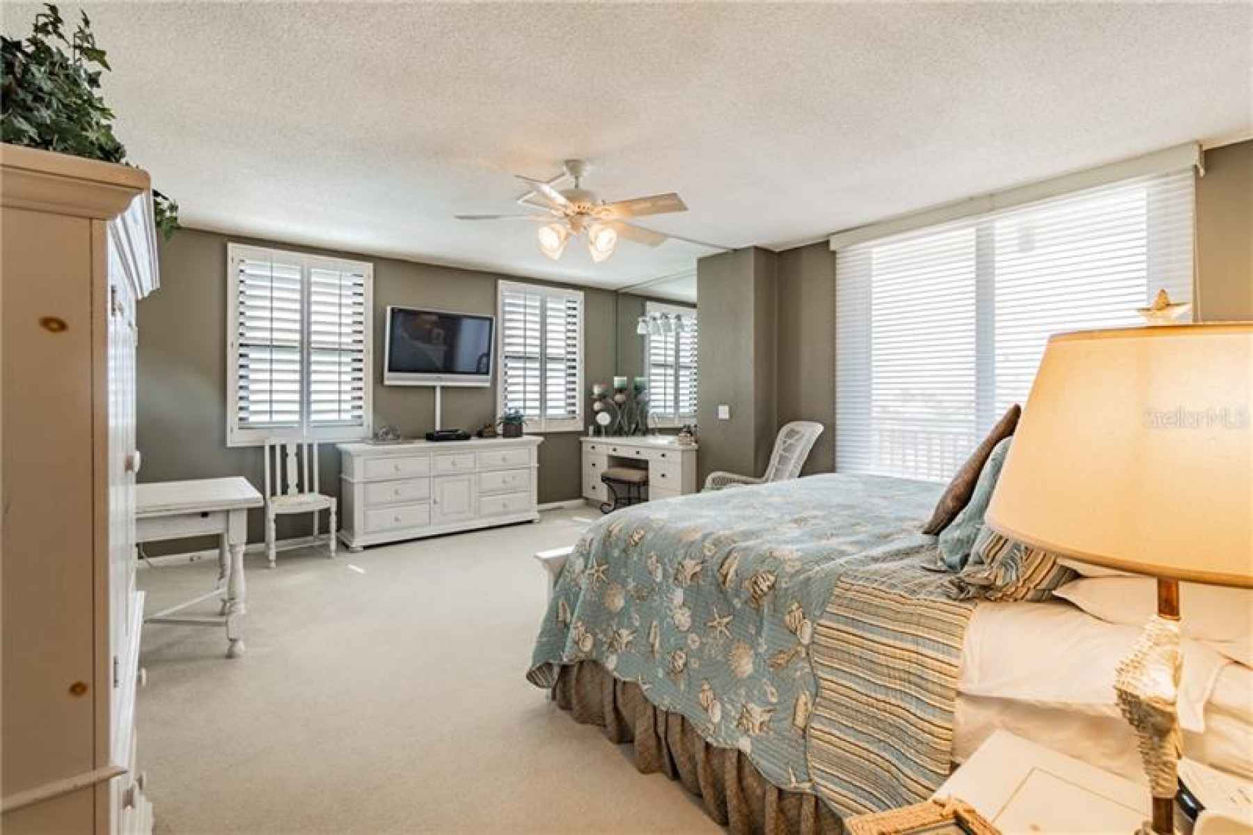Enter the Spacious Master Bedroom, with Open Patio Access & Water Views