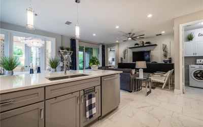 The Kitchen features GE MONOGRAM appliances, quartz counters, soft-close drawers, a stainless farmho