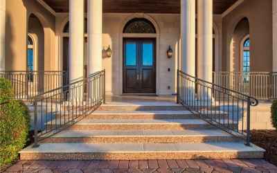 Grande Front Entry with Mosaic Tile Detailing & Three Oversized French Doors