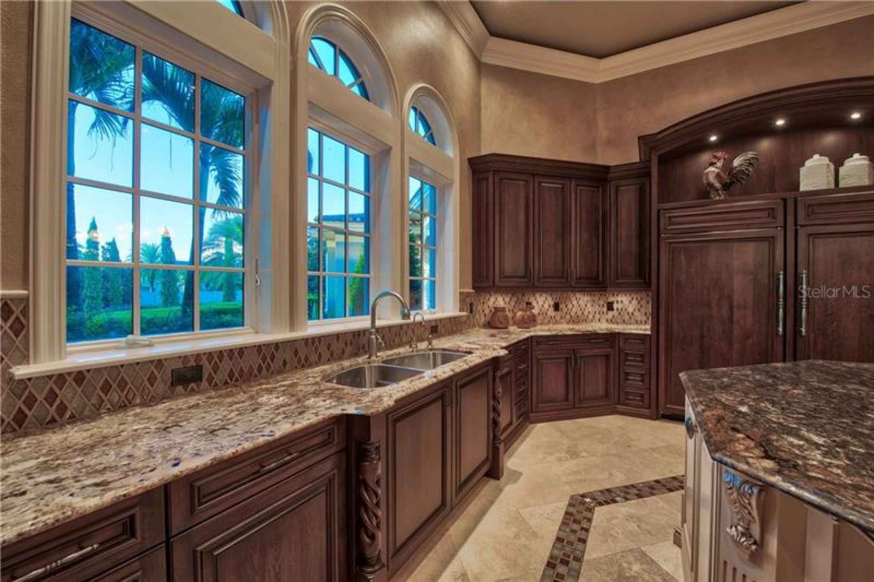 Tile Backsplash, Solid Wood Cabinetry, Stone Counters and Cleverly Hidden Appliances