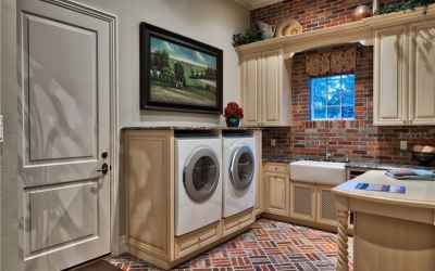 Laundry Room with Brick Flooring and Wall