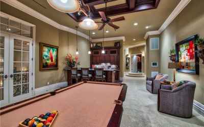 Game Room with Balcony Access to view the Front of Estate