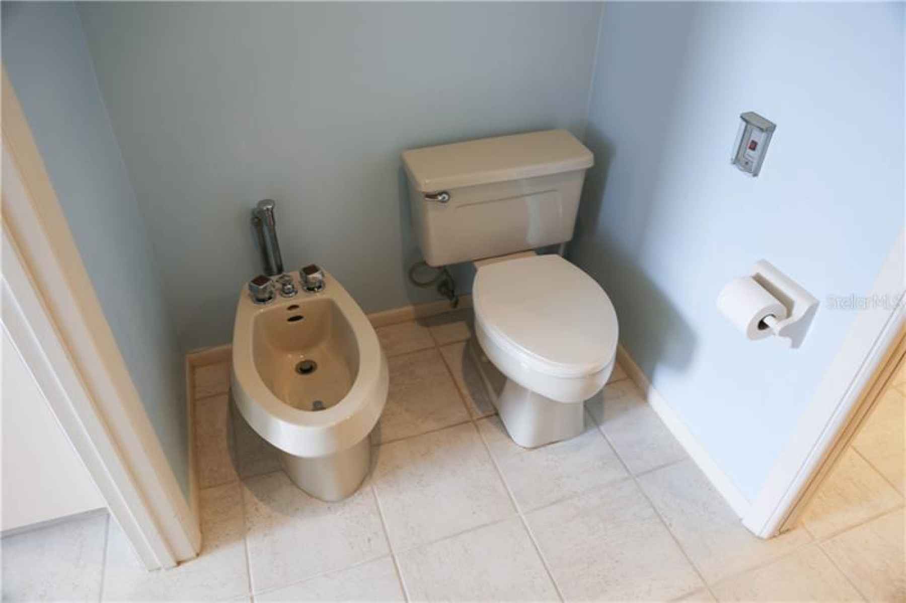 separate room with toilet, bidet, shower and bathtub