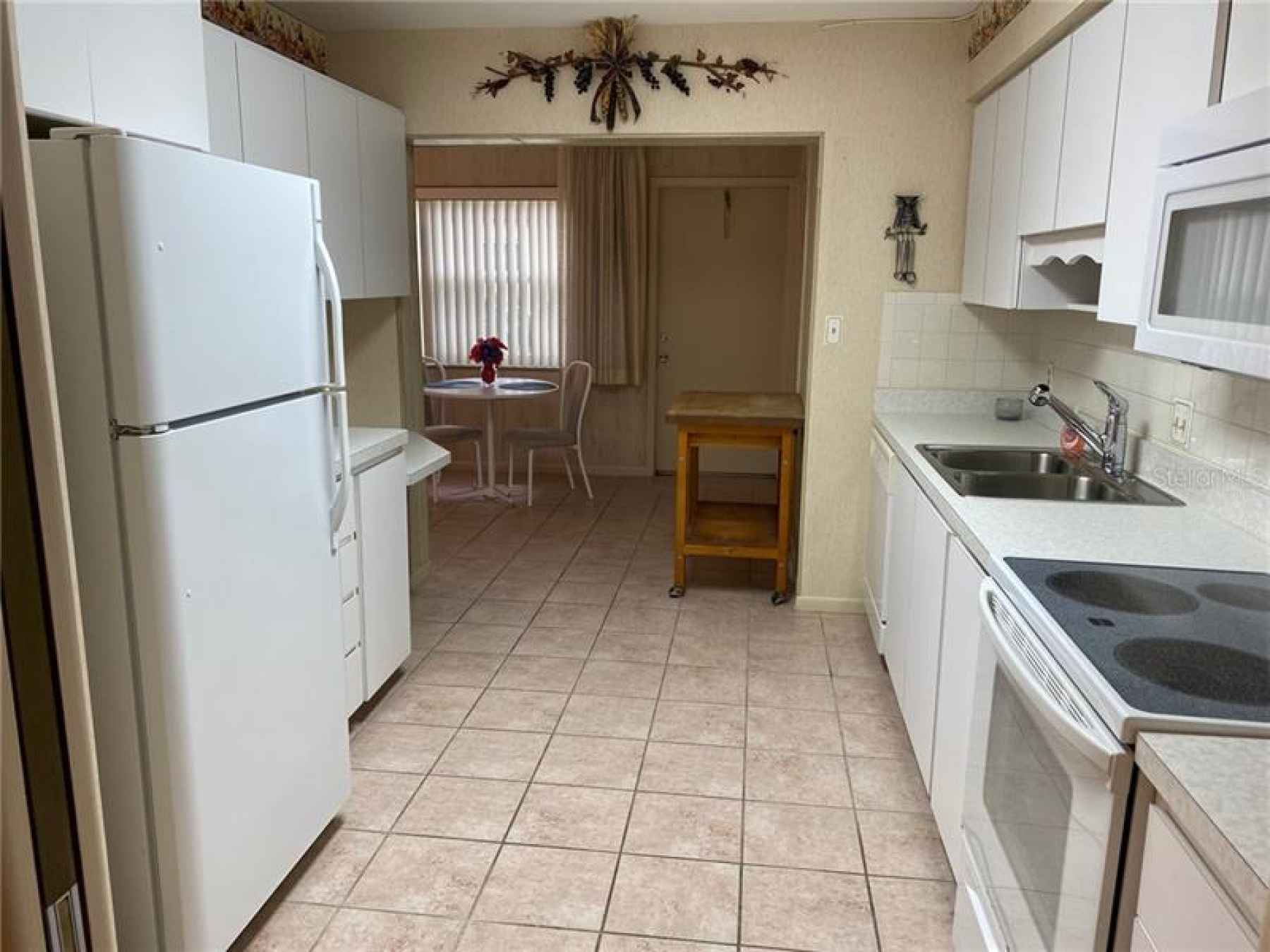 Spacious and Bright Kitchen! Island cart can be moved to center of Kitchen as needed.