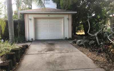 Path to right of garage leads to front door.