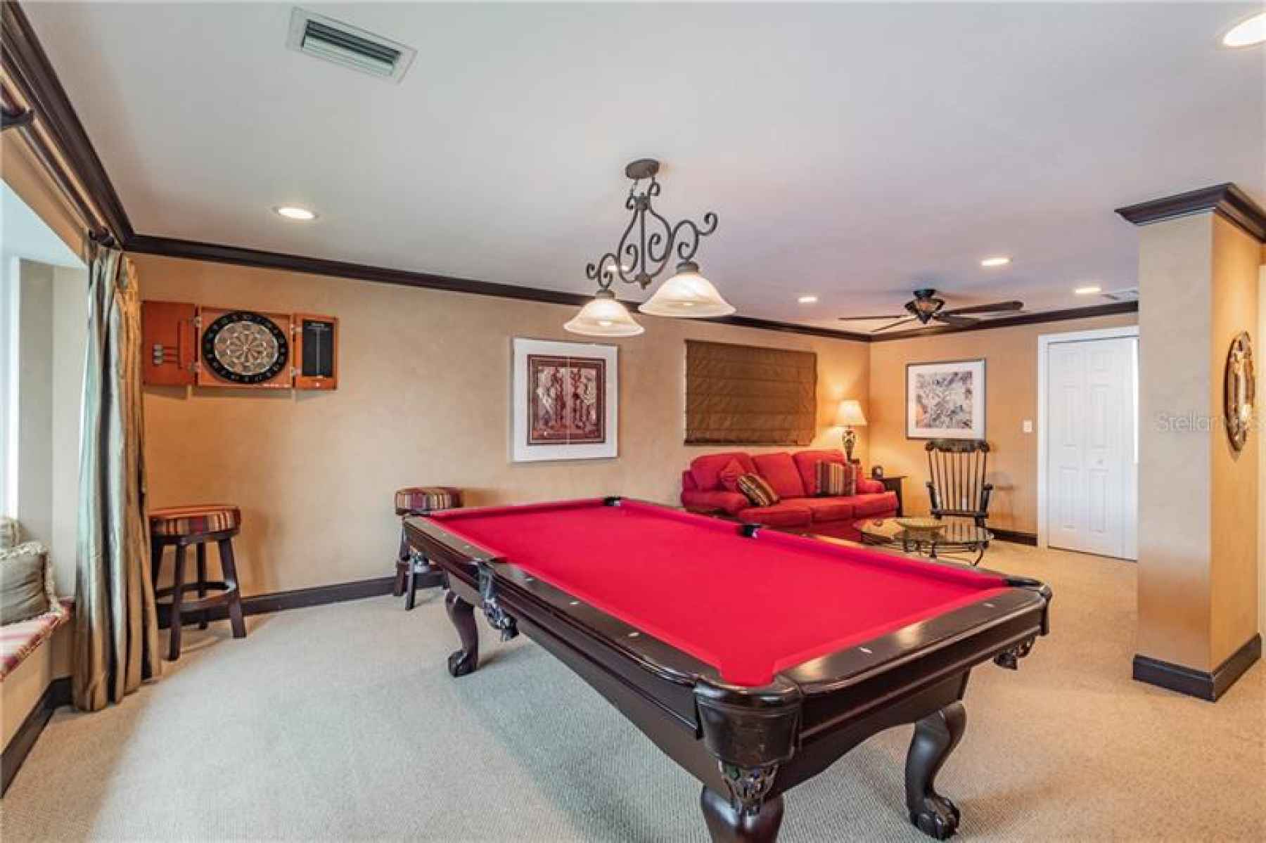 Bonus suite, currently used as game room with study area for the kids. Full bath with pool access ma