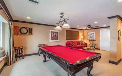 Bonus suite, currently used as game room with study area for the kids. Full bath with pool access ma