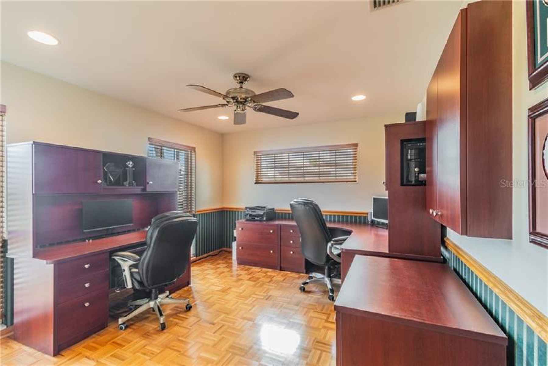 Dedicated office in front of house offers quiet workspace away from hub of family.