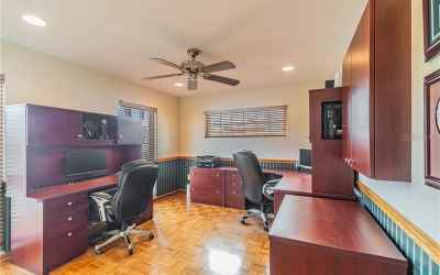 Dedicated office in front of house offers quiet workspace away from hub of family.