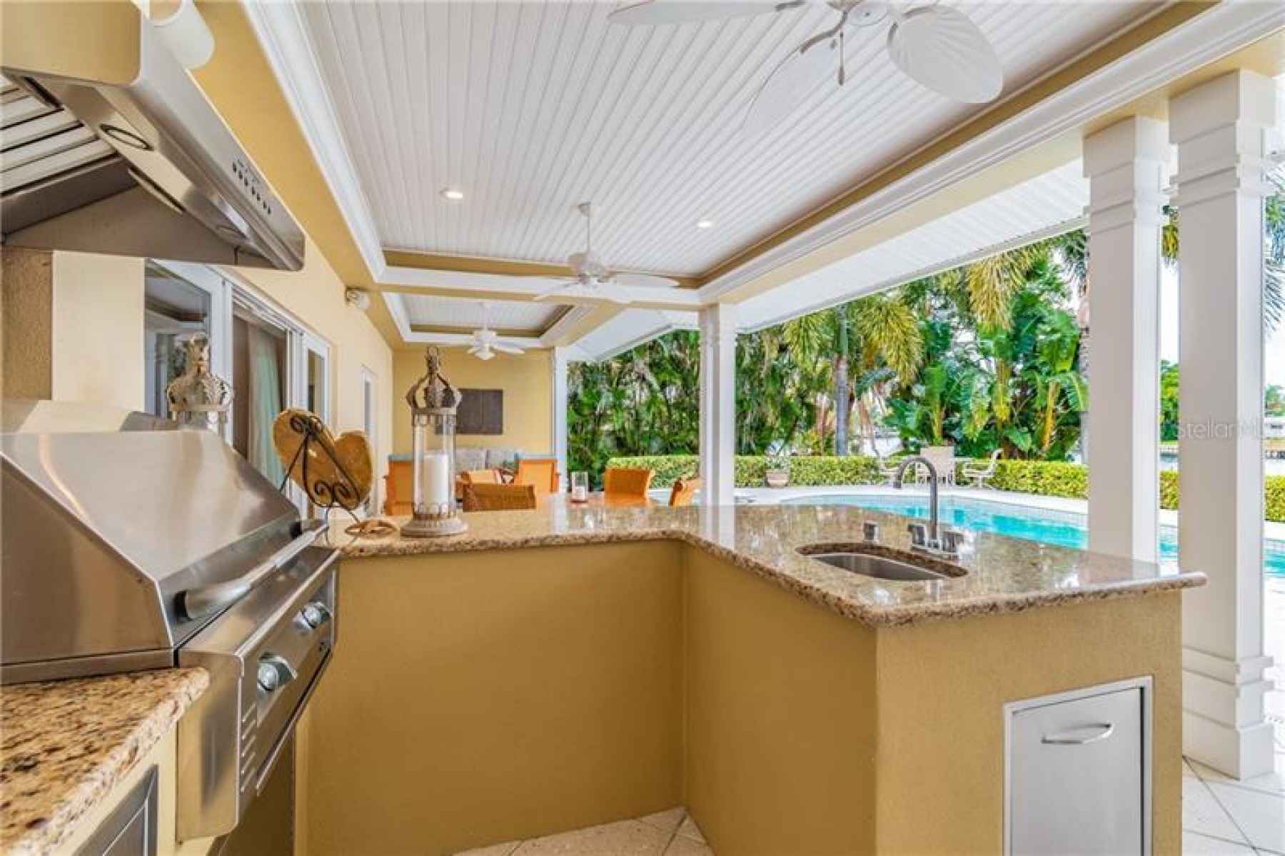Wide covered Lanai with outdoor kitchen.