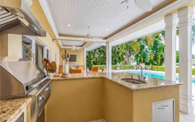 Wide covered Lanai with outdoor kitchen.