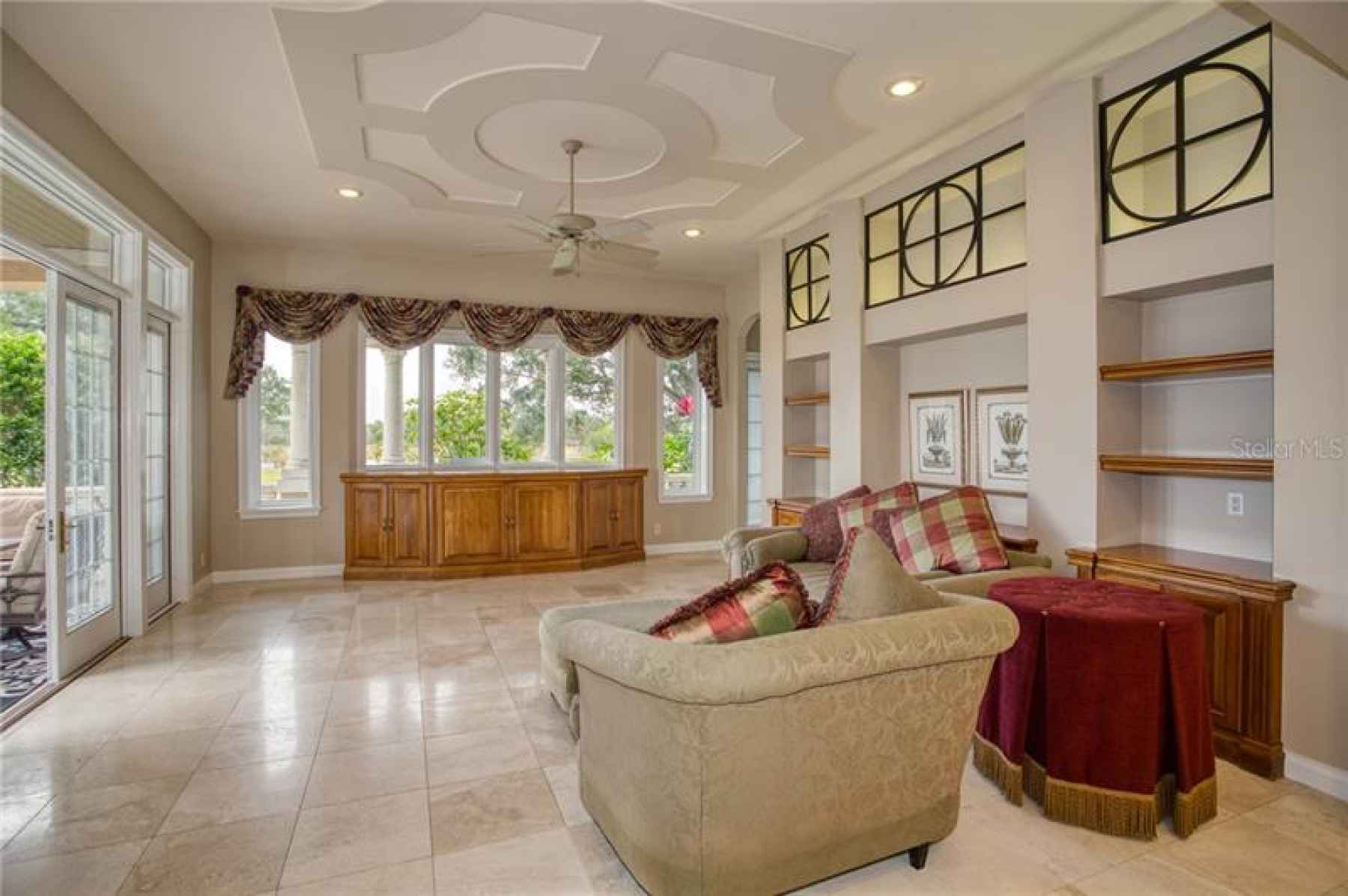 Great Room/Family Room with detailed ceiling