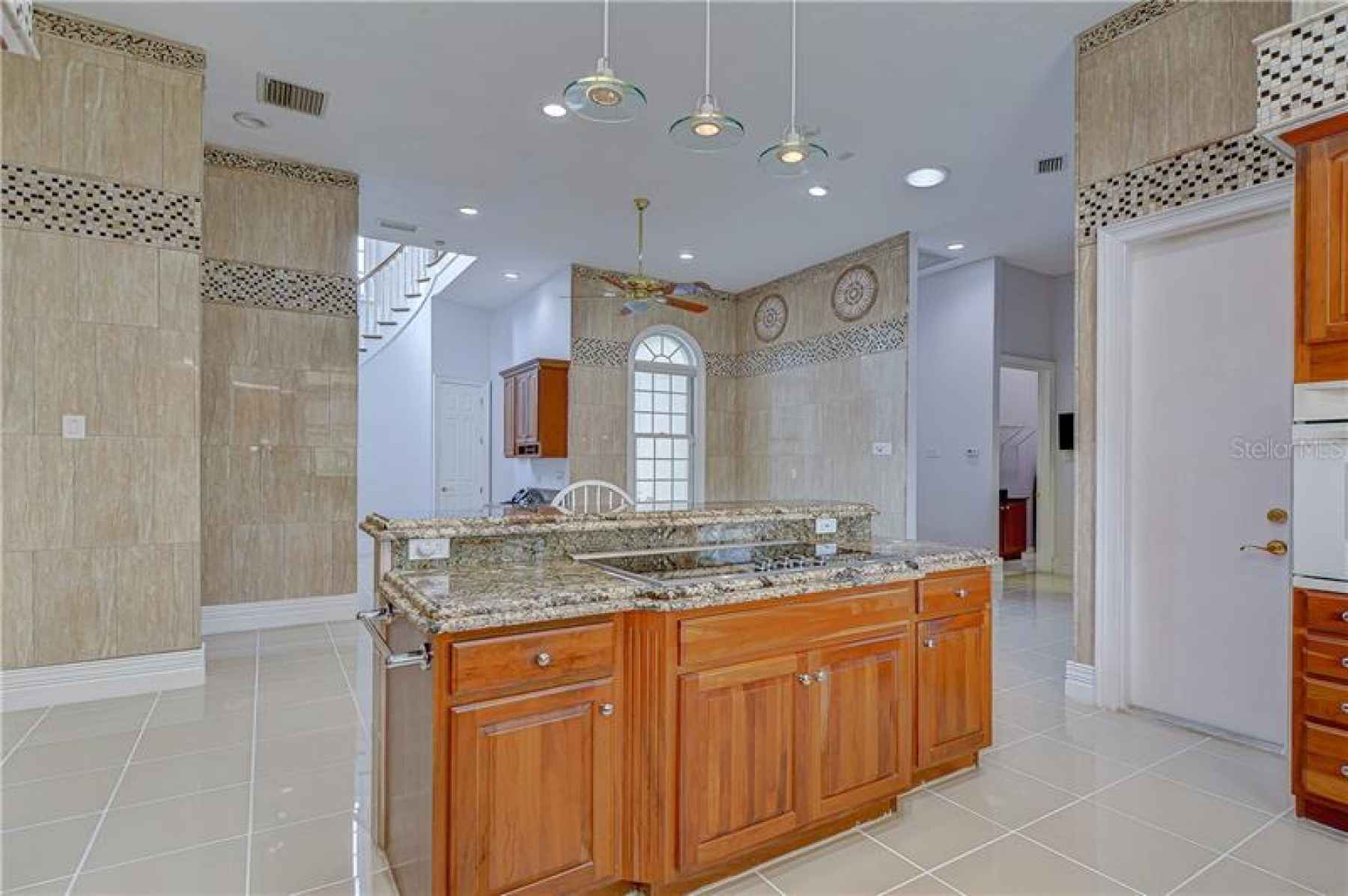 Kitchen features all the bells and whistles including Granite counters, built-in appliances, trash c