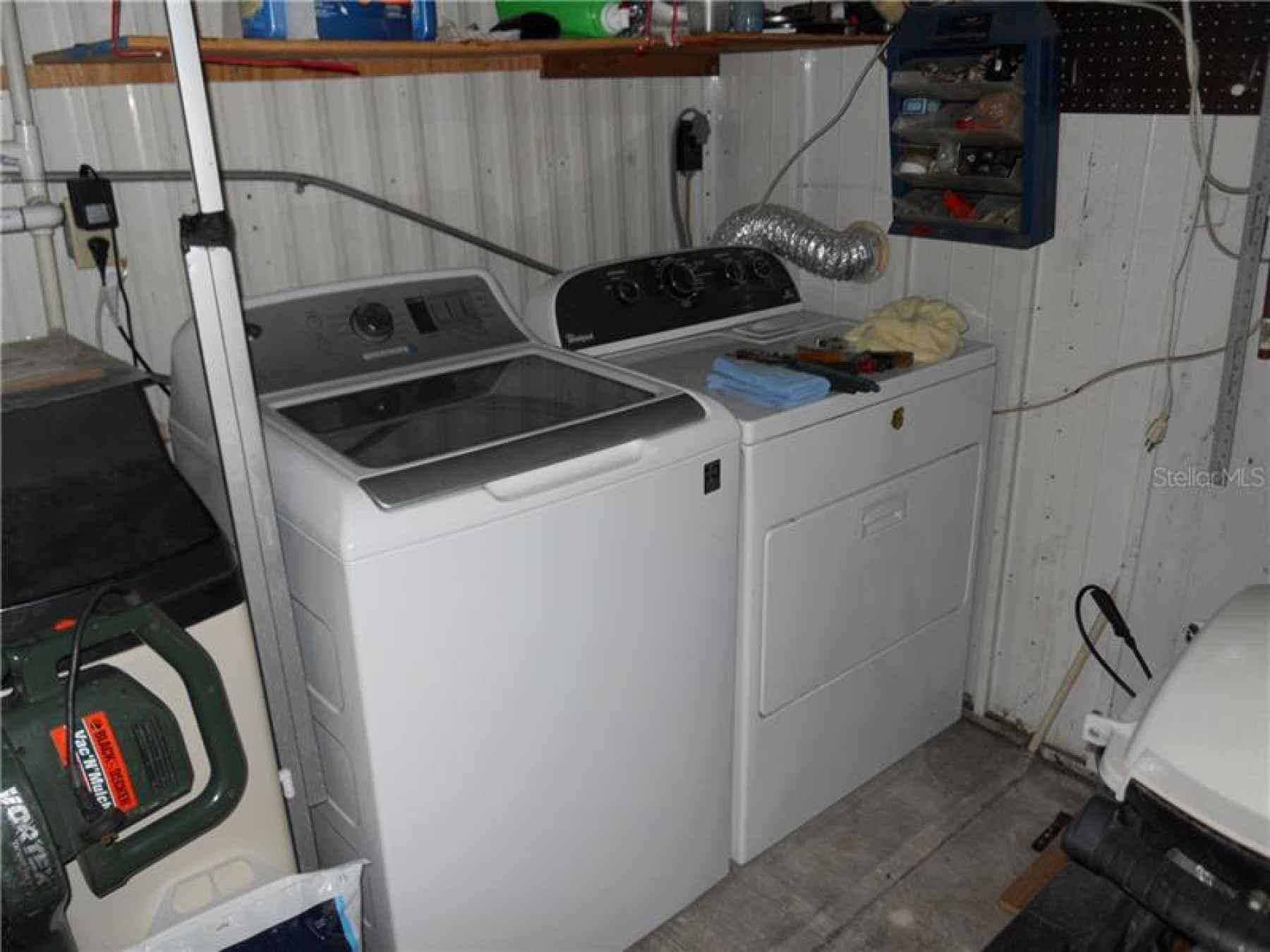 Washer and dryer in utility room.