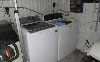 Washer and dryer in utility room.