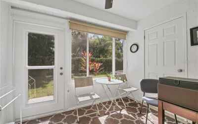 Florida room has a storage closet and NEW WINDOWS and OUTSIDE DOOR.  Great private view!