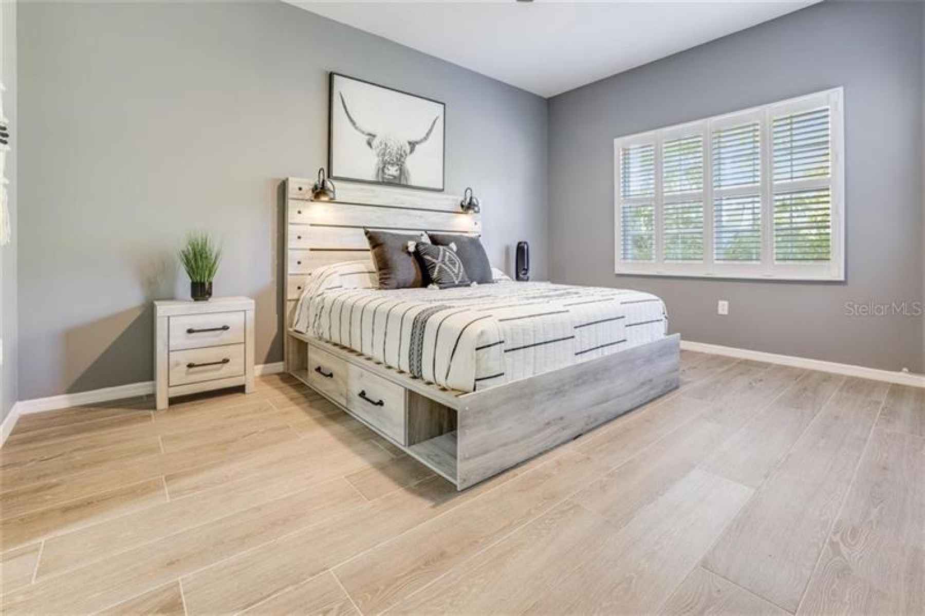 Master Bedroom- Extra storage under bed, window looks out to green space and pond
