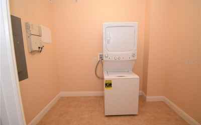 Laundry/utility room. New full size stack washer/dryer.