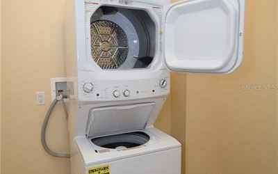 New full size stack washer/dryer.