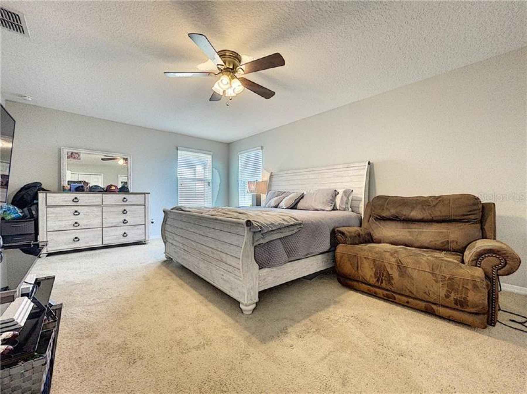 Spacious bedroom on second floor with attached bathroom
