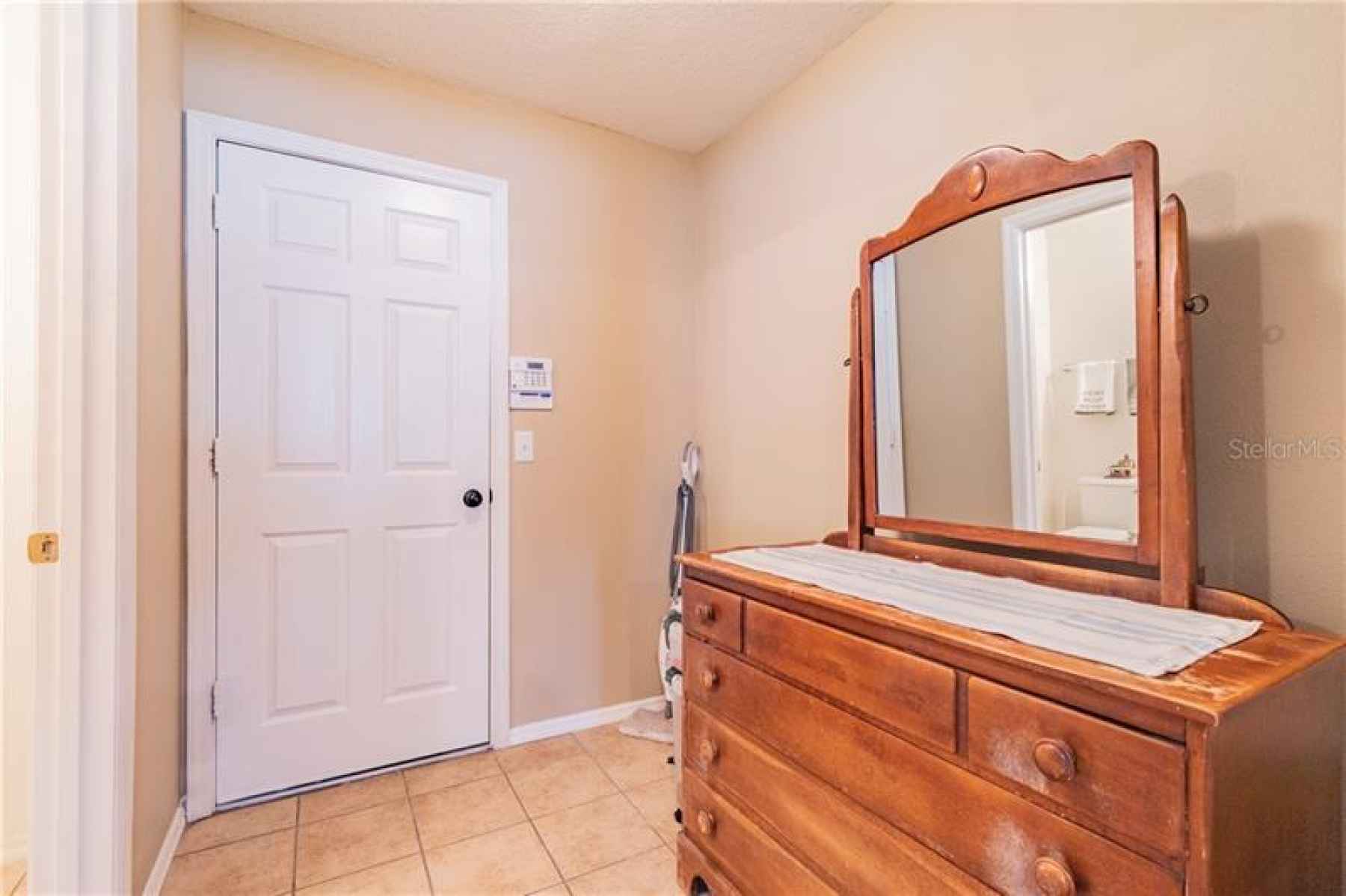 Could be walk in Pantry, Door leads to the 2 Car Garage.