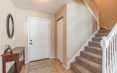 Entry Way is Tiled, Large under stairs Closet/storage. Brand new carpeting on the stairs