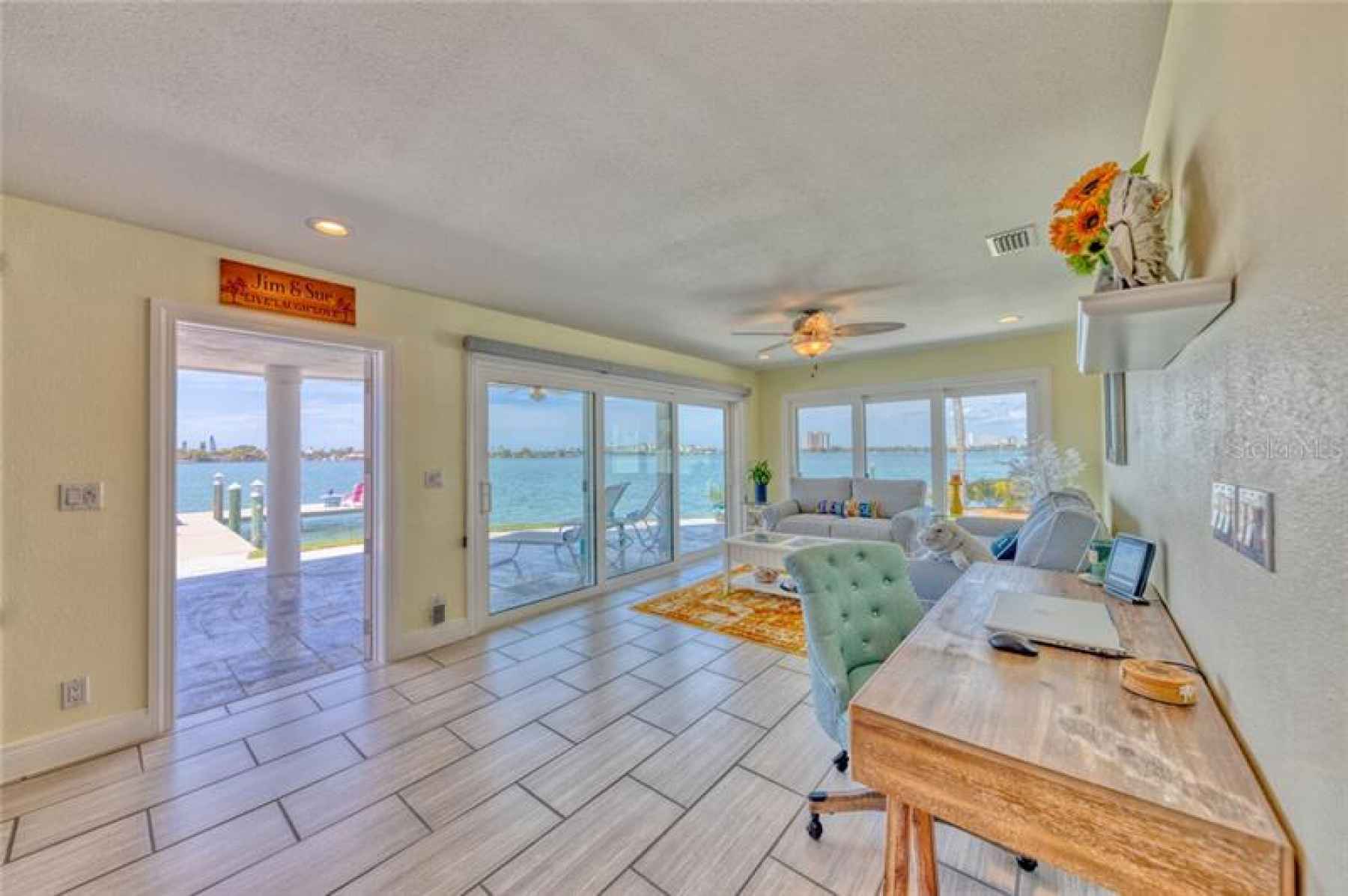 Entertainment area #1 with triple sliders that open up to let the sunshine and fresh sea air in!