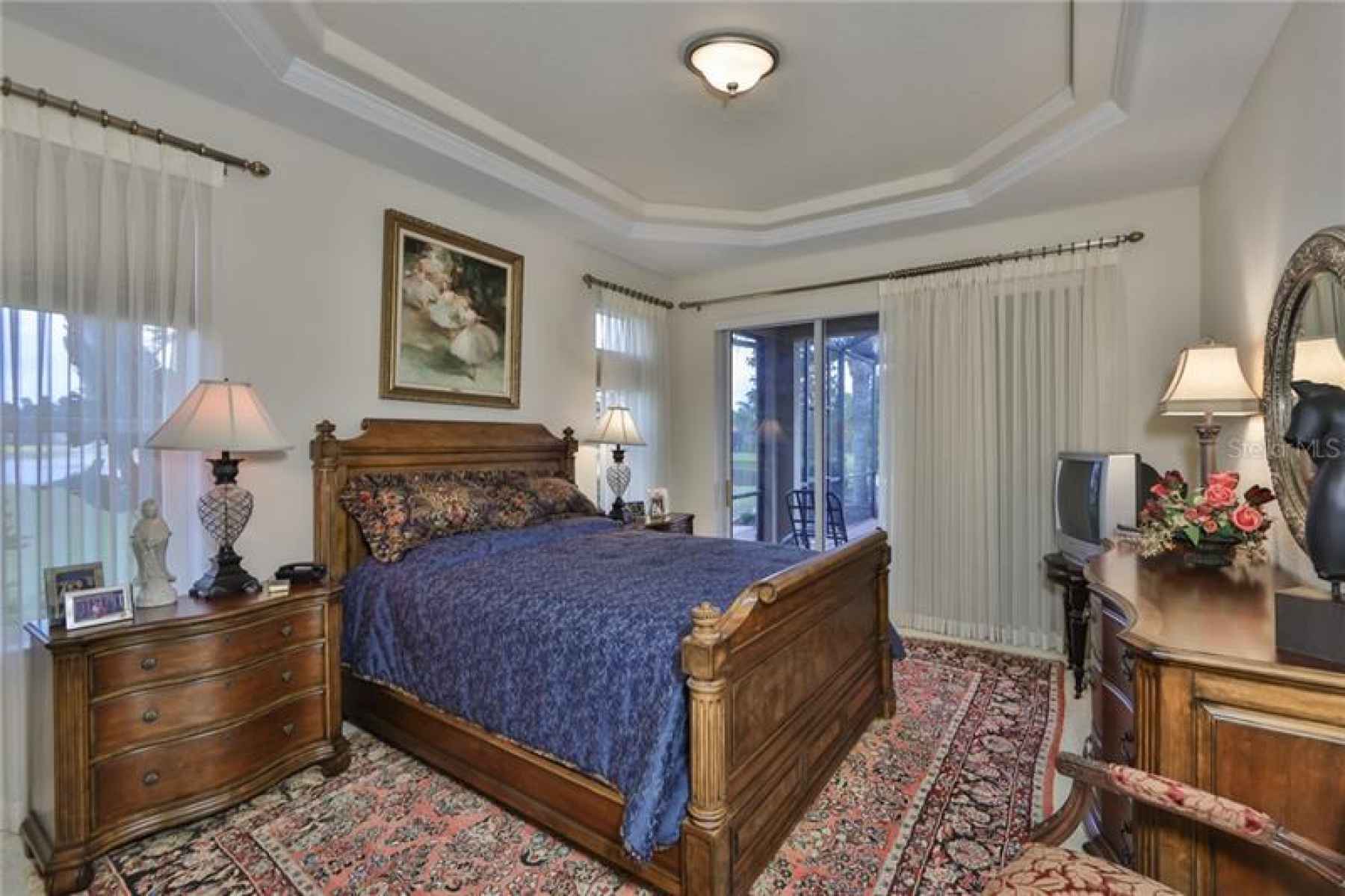 The Master bedroom is spacious and dipped in 'comfort', with a tray ceiling, large windows, large sl