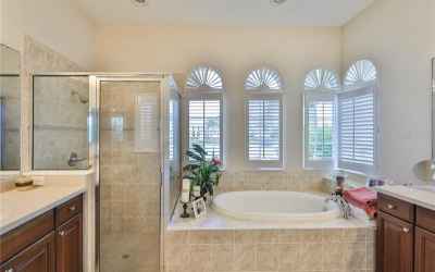 Master bath is large, with plantion shutters, soaking tub and dual vanities.