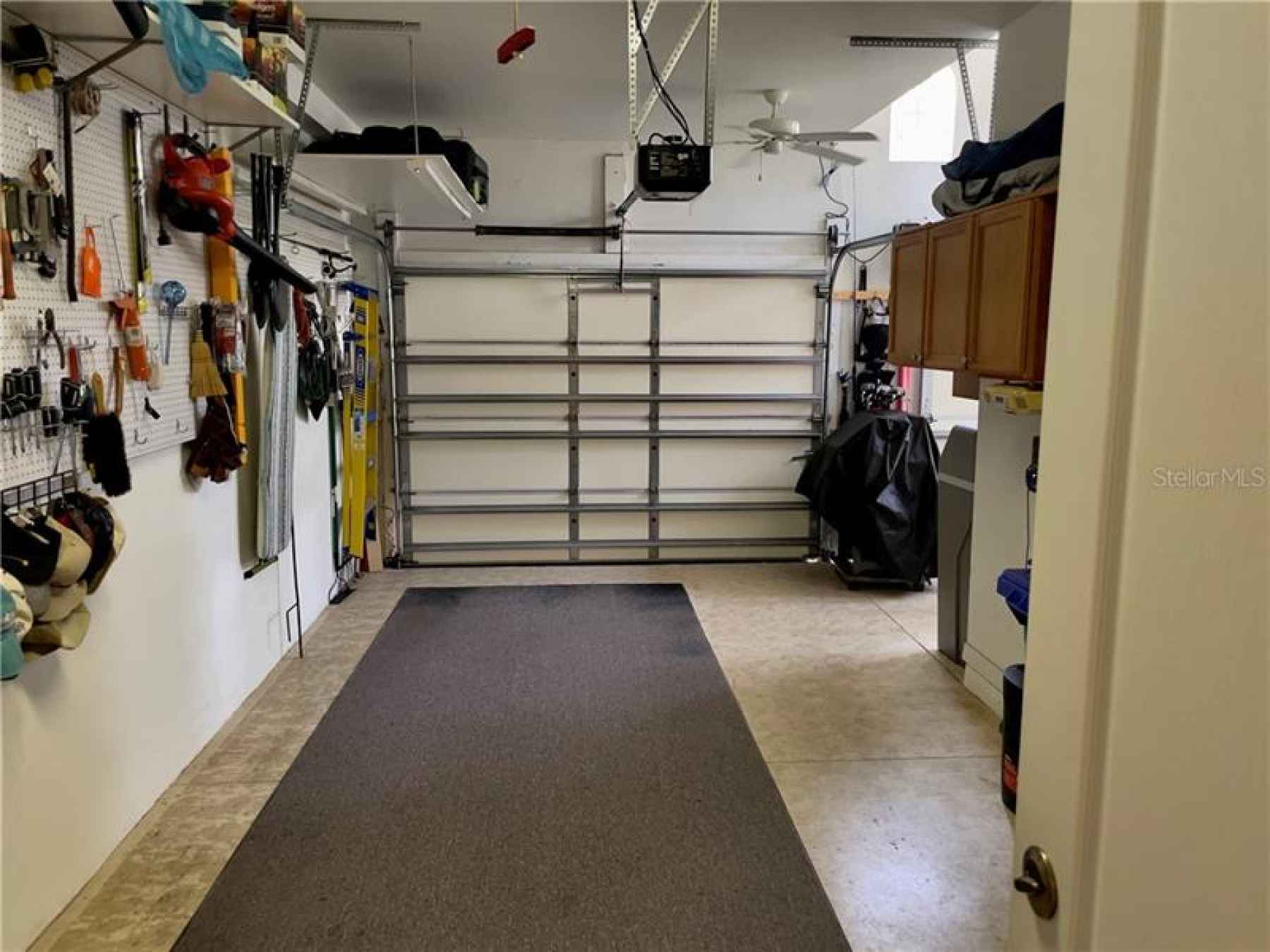 Garage.  Notice the cupboards for extra storage.