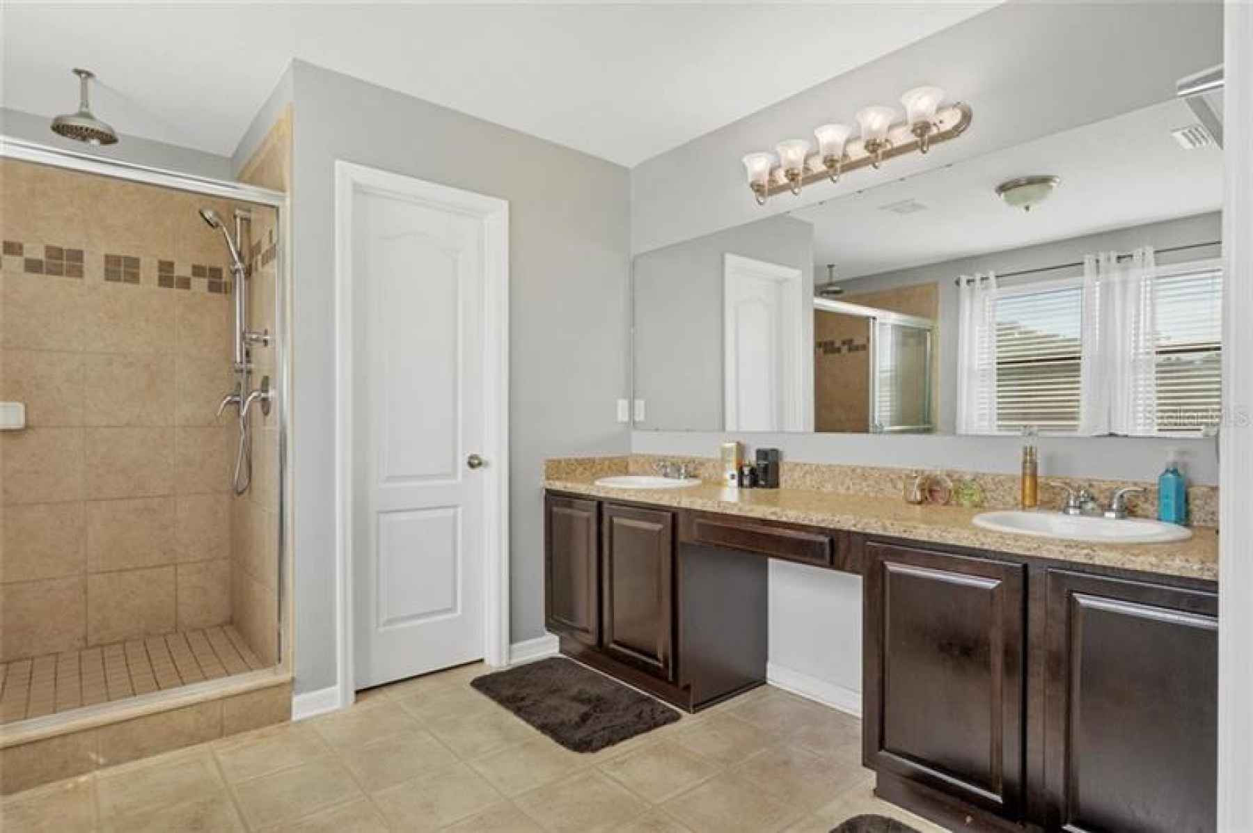 Owner's retreat en suite bath with dual sinks & shower.
