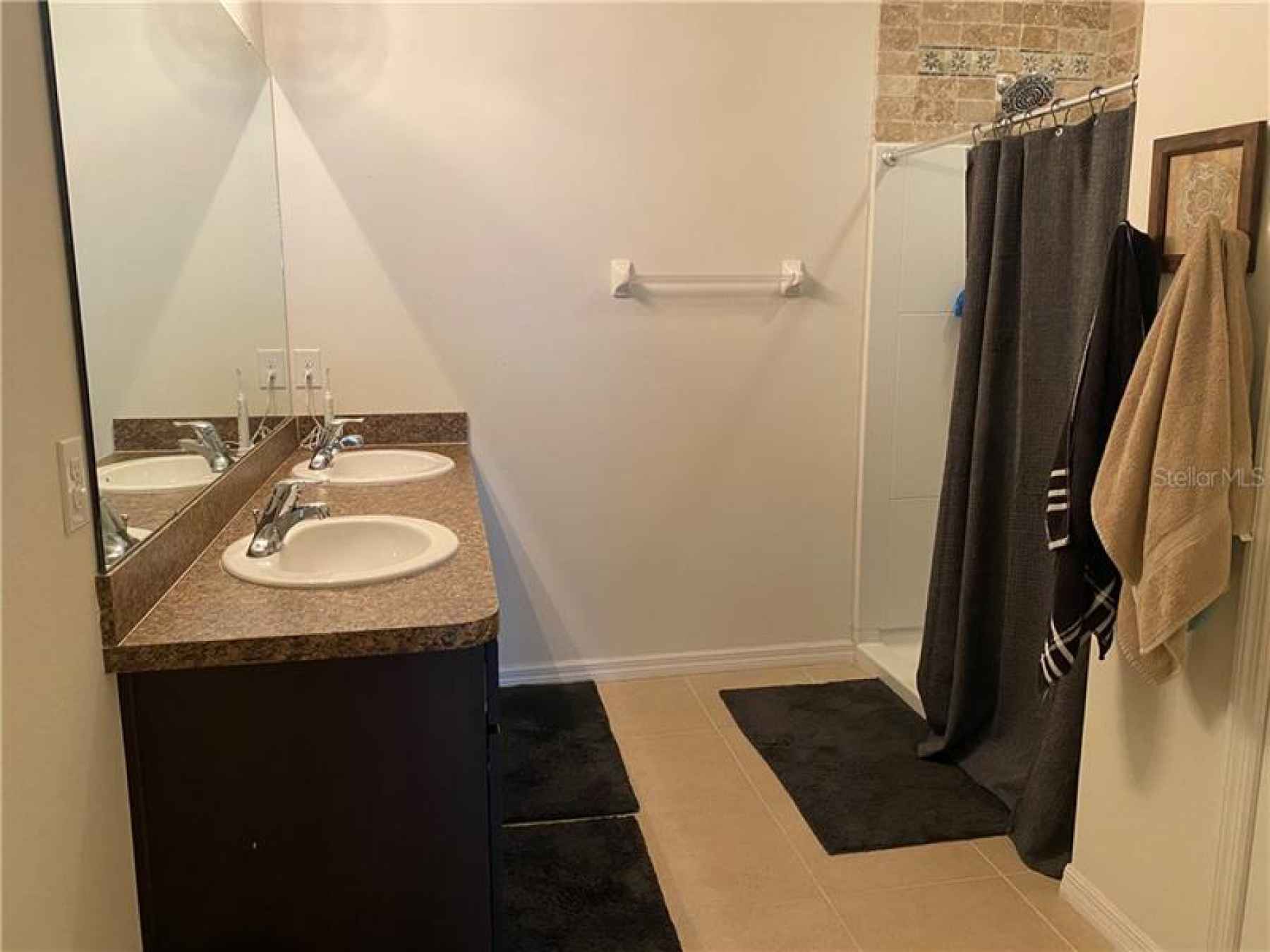 master bathroom double vanity and walk-in shower