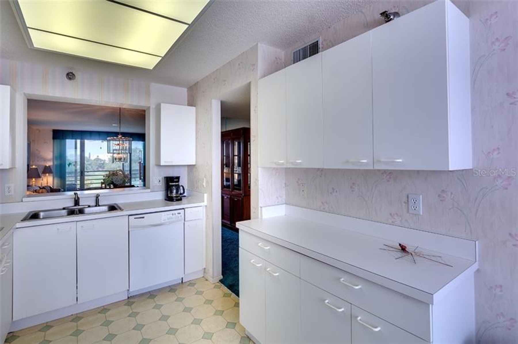 Loads of cabinets, eat in kitchen, and a buffet.