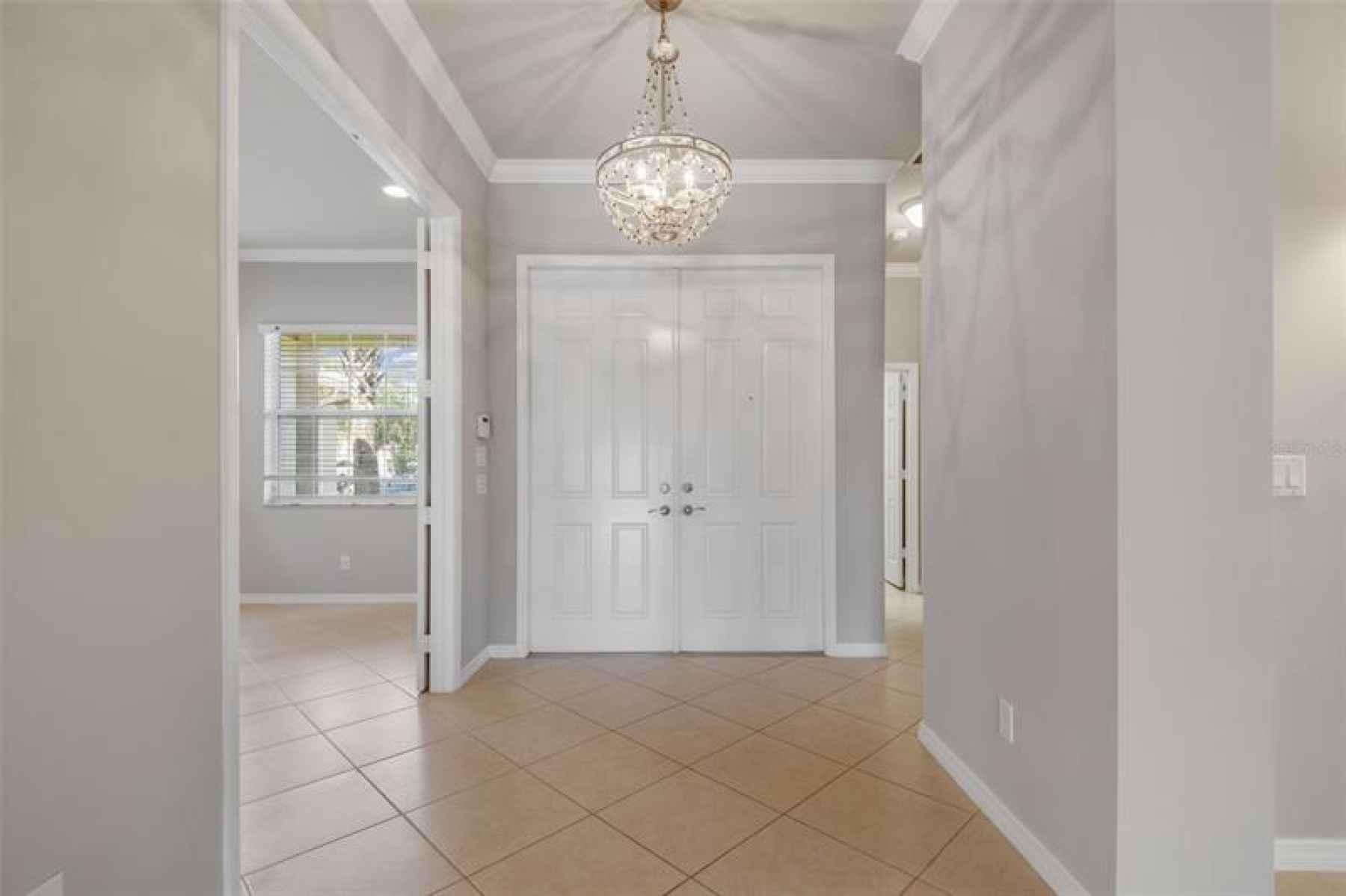 FOYER WITH GORGEOUS LIGHT FIXTURE