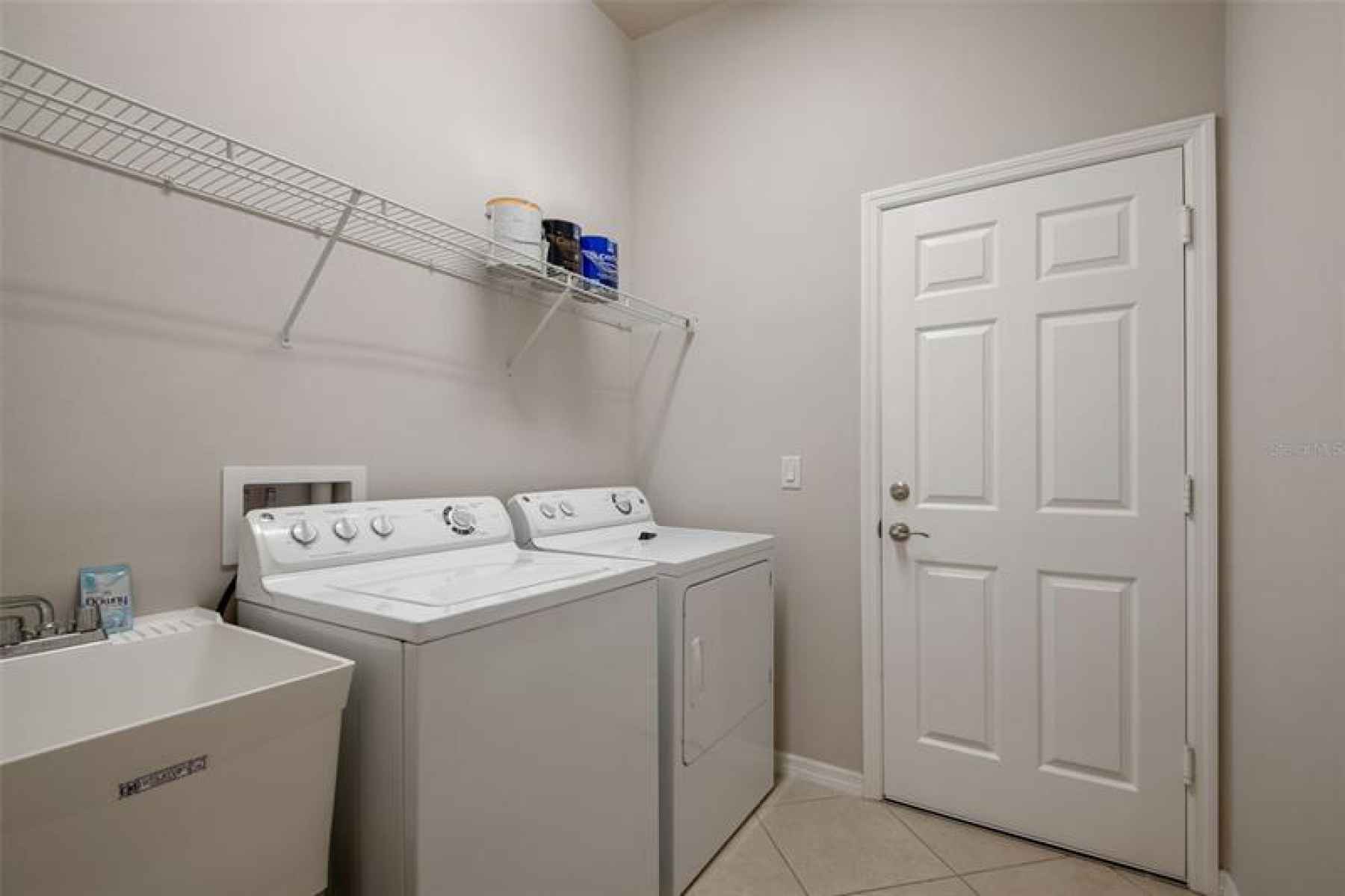 LAUNDRY ROOM WITH SLOP SINK , WASHER & DRYER