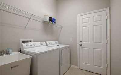 LAUNDRY ROOM WITH SLOP SINK , WASHER & DRYER