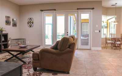 FAMILY ROOM WITH FRENCH DOORS LEADING TO BACK LANAI