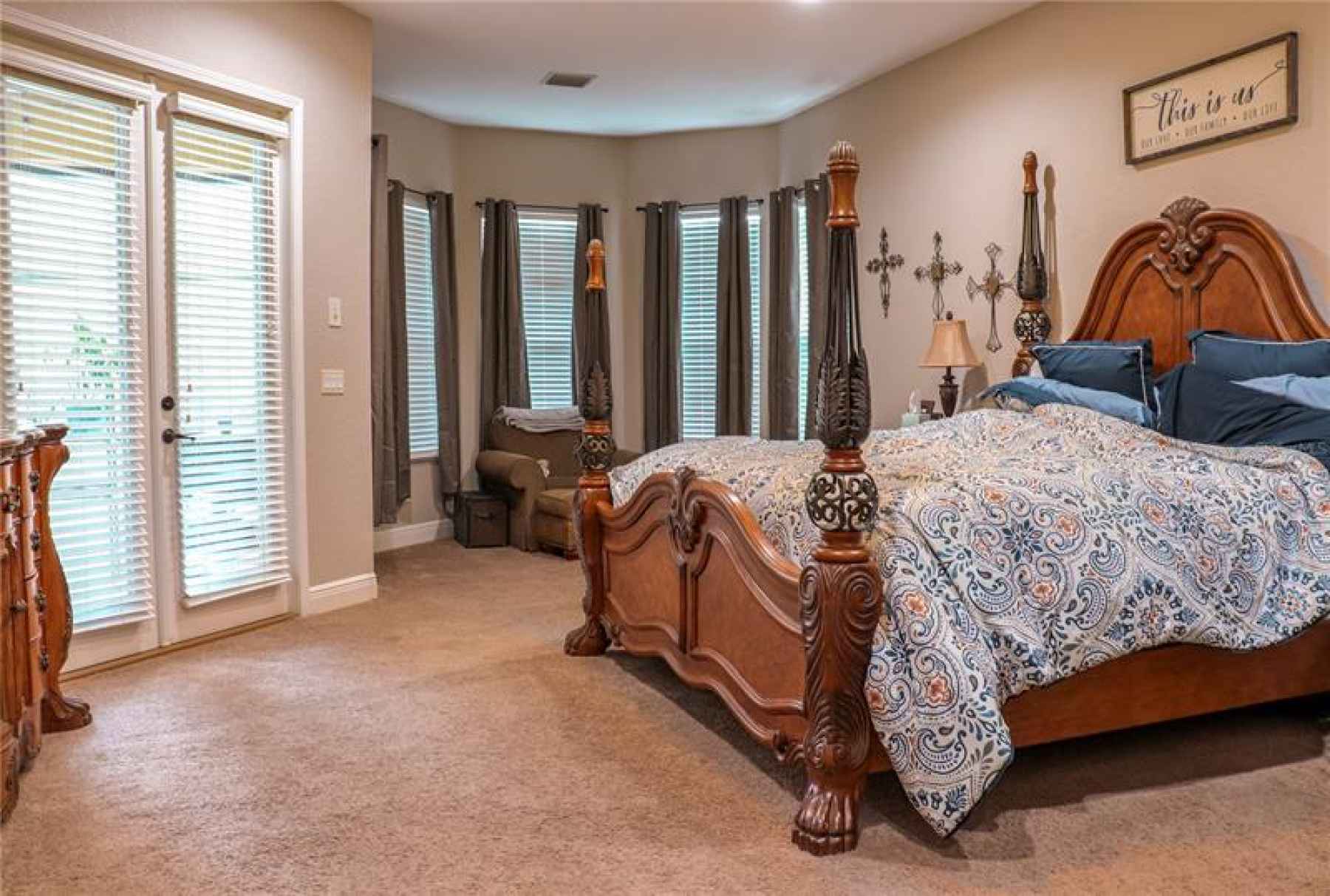 MASTER BEDROOM WITH SITTING AREA AND FRENCH DOORS TO BACK PORCH