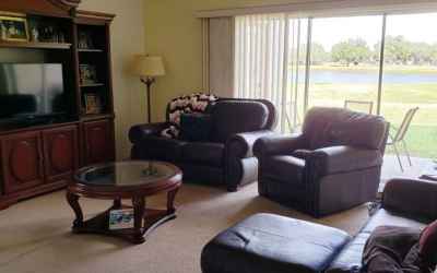 Family room looking out to 16th hole of golf coarse and water view